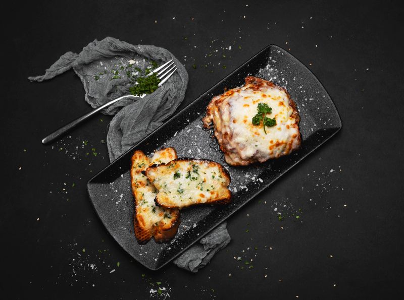 Garlic bread with cheese and herbs appetizer