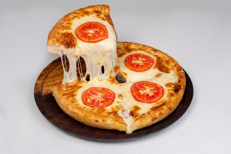 Margherita thin crust pizza with fresh basil